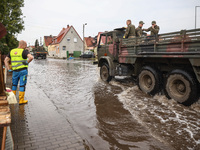 People are cleaning their houses which were damaged by water after Nysa Klodzka river flooded town of Lewin Brzeski in southwestern Poland....