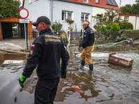 Firefighters are pumping out water from residential areas after Nysa Klodzka river flooded town of Lewin Brzeski in southwestern Poland. Sep...