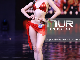 A contestant walks the ramp during the grand finale of Miss Universe India 2024 in Jaipur, Rajasthan, India, on September 22, 2024. (