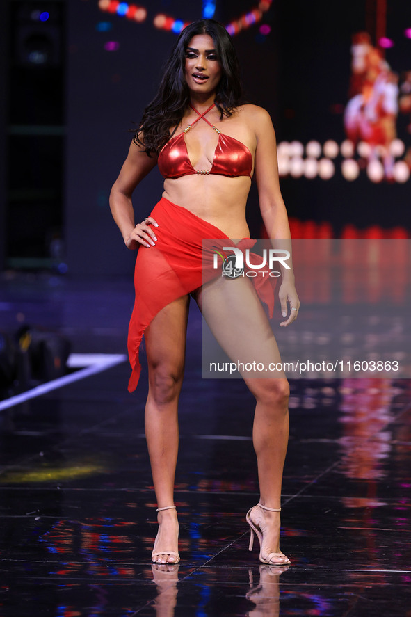 A contestant walks the ramp during the grand finale of Miss Universe India 2024 in Jaipur, Rajasthan, India, on September 22, 2024. 