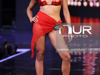 A contestant walks the ramp during the grand finale of Miss Universe India 2024 in Jaipur, Rajasthan, India, on September 22, 2024. (