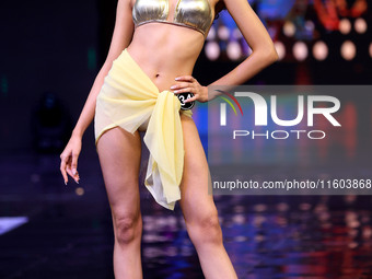 A contestant walks the ramp during the grand finale of Miss Universe India 2024 in Jaipur, Rajasthan, India, on September 22, 2024. (