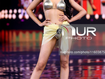 A contestant walks the ramp during the grand finale of Miss Universe India 2024 in Jaipur, Rajasthan, India, on September 22, 2024. (