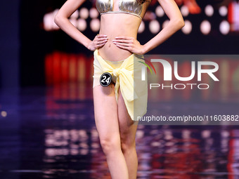 A contestant walks the ramp during the grand finale of Miss Universe India 2024 in Jaipur, Rajasthan, India, on September 22, 2024. (