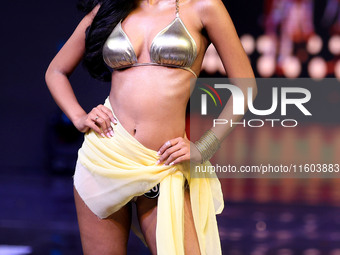 A contestant walks the ramp during the grand finale of Miss Universe India 2024 in Jaipur, Rajasthan, India, on September 22, 2024. (