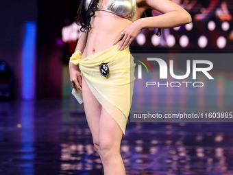 A contestant walks the ramp during the grand finale of Miss Universe India 2024 in Jaipur, Rajasthan, India, on September 22, 2024. (