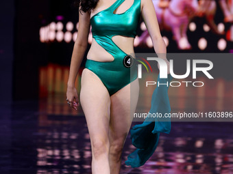 A contestant walks the ramp during the grand finale of Miss Universe India 2024 in Jaipur, Rajasthan, India, on September 22, 2024. (