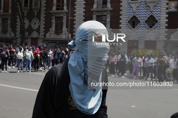 Colleagues of the 43 missing students from Ayotzinapa protest outside the Ministry of the Interior in Mexico City, Mexico, on September 23,...