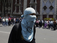 Colleagues of the 43 missing students from Ayotzinapa protest outside the Ministry of the Interior in Mexico City, Mexico, on September 23,...