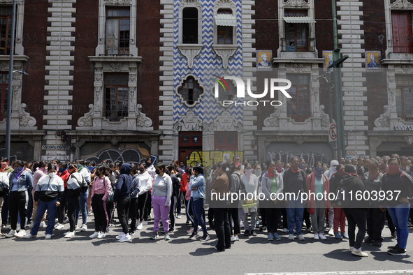 Colleagues of the 43 missing students from Ayotzinapa protest outside the Ministry of the Interior in Mexico City, Mexico, on September 23,...