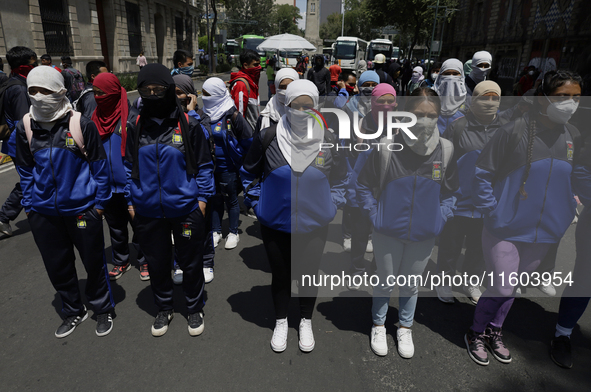 Colleagues of the 43 missing students from Ayotzinapa protest outside the Ministry of the Interior in Mexico City, Mexico, on September 23,...