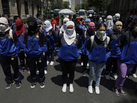 Colleagues of the 43 missing students from Ayotzinapa protest outside the Ministry of the Interior in Mexico City, Mexico, on September 23,...