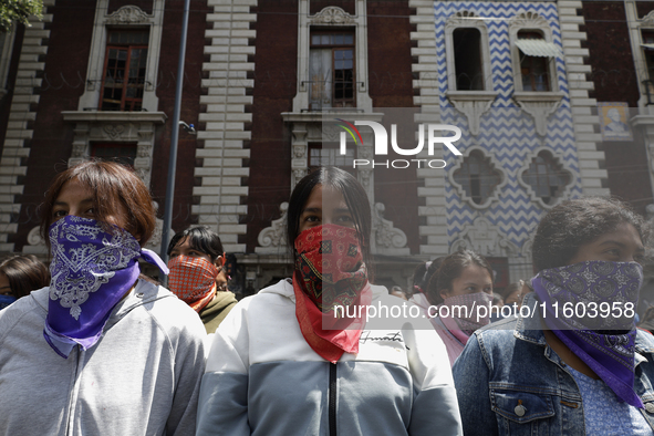 Colleagues of the 43 missing students from Ayotzinapa protest outside the Ministry of the Interior in Mexico City, Mexico, on September 23,...