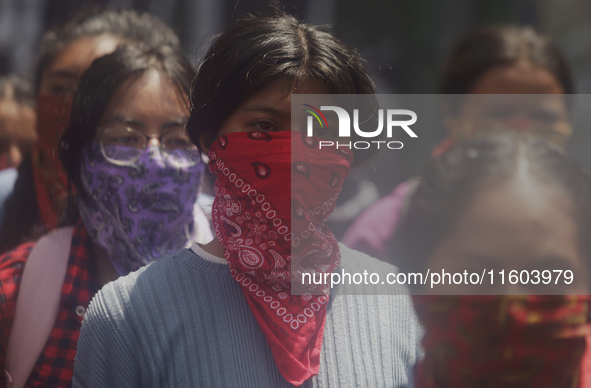 Colleagues of the 43 missing students from Ayotzinapa protest outside the Ministry of the Interior in Mexico City, Mexico, on September 23,...