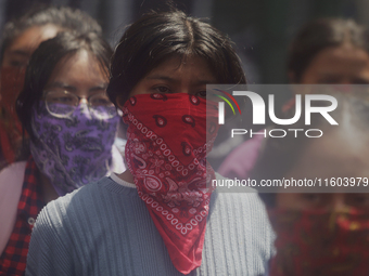 Colleagues of the 43 missing students from Ayotzinapa protest outside the Ministry of the Interior in Mexico City, Mexico, on September 23,...