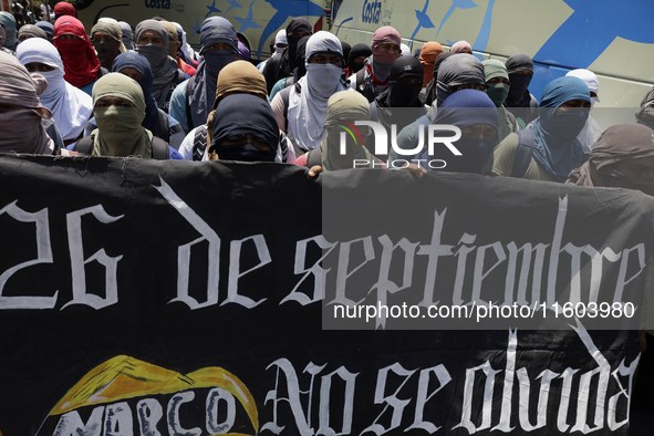 Colleagues of the 43 missing students from Ayotzinapa protest outside the Ministry of the Interior in Mexico City, Mexico, on September 23,...