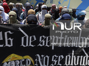 Colleagues of the 43 missing students from Ayotzinapa protest outside the Ministry of the Interior in Mexico City, Mexico, on September 23,...