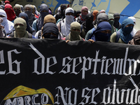 Colleagues of the 43 missing students from Ayotzinapa protest outside the Ministry of the Interior in Mexico City, Mexico, on September 23,...