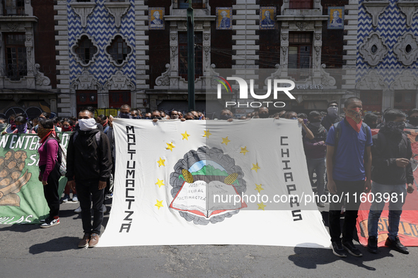 Colleagues of the 43 missing students from Ayotzinapa protest outside the Ministry of the Interior in Mexico City, Mexico, on September 23,...