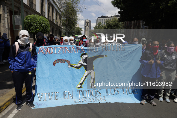 Colleagues of the 43 missing students from Ayotzinapa protest outside the Ministry of the Interior in Mexico City, Mexico, on September 23,...