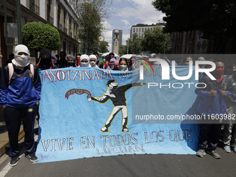 Colleagues of the 43 missing students from Ayotzinapa protest outside the Ministry of the Interior in Mexico City, Mexico, on September 23,...