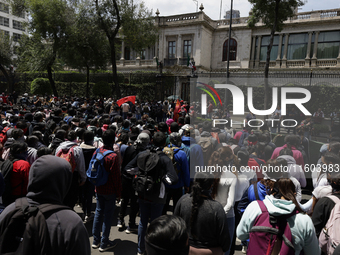 Colleagues of the 43 missing students from Ayotzinapa protest outside the Ministry of the Interior in Mexico City, Mexico, on September 23,...