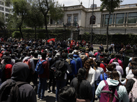 Colleagues of the 43 missing students from Ayotzinapa protest outside the Ministry of the Interior in Mexico City, Mexico, on September 23,...