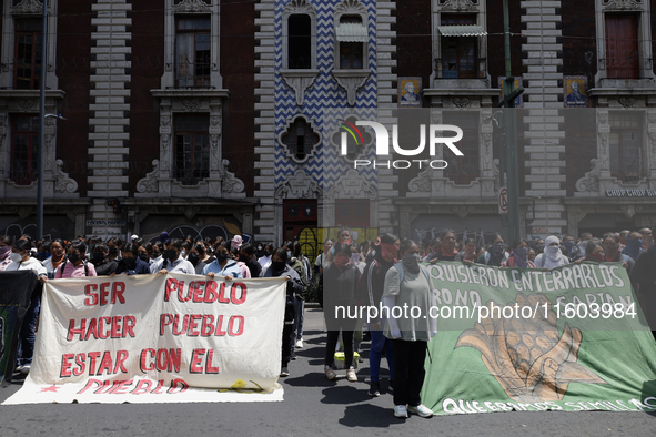 Colleagues of the 43 missing students from Ayotzinapa protest outside the Ministry of the Interior in Mexico City, Mexico, on September 23,...