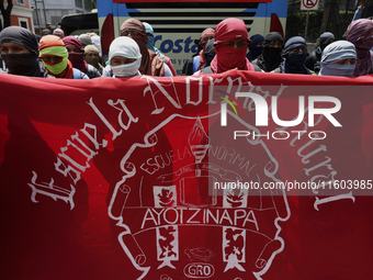 Colleagues of the 43 missing students from Ayotzinapa protest outside the Ministry of the Interior in Mexico City, Mexico, on September 23,...