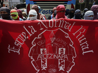 Colleagues of the 43 missing students from Ayotzinapa protest outside the Ministry of the Interior in Mexico City, Mexico, on September 23,...