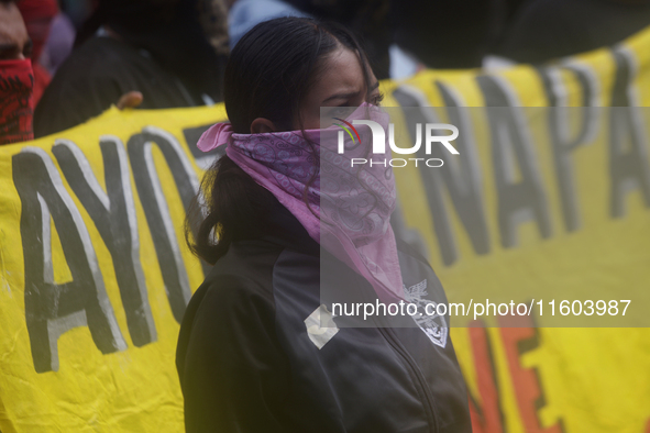 Colleagues of the 43 missing students from Ayotzinapa protest outside the Ministry of the Interior in Mexico City, Mexico, on September 23,...