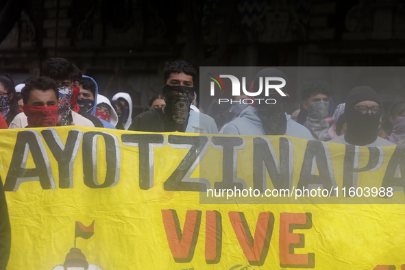 Colleagues of the 43 missing students from Ayotzinapa protest outside the Ministry of the Interior in Mexico City, Mexico, on September 23,...