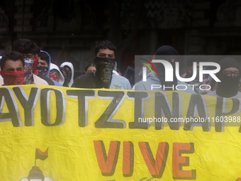 Colleagues of the 43 missing students from Ayotzinapa protest outside the Ministry of the Interior in Mexico City, Mexico, on September 23,...