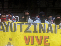 Colleagues of the 43 missing students from Ayotzinapa protest outside the Ministry of the Interior in Mexico City, Mexico, on September 23,...