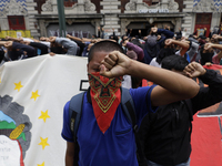 Colleagues of the 43 missing students from Ayotzinapa protest with fists raised outside the Ministry of the Interior in Mexico City, Mexico,...