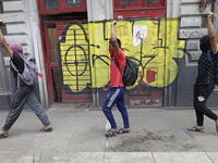 Colleagues of the 43 missing students from Ayotzinapa protest with fists raised outside the Ministry of the Interior in Mexico City, Mexico,...