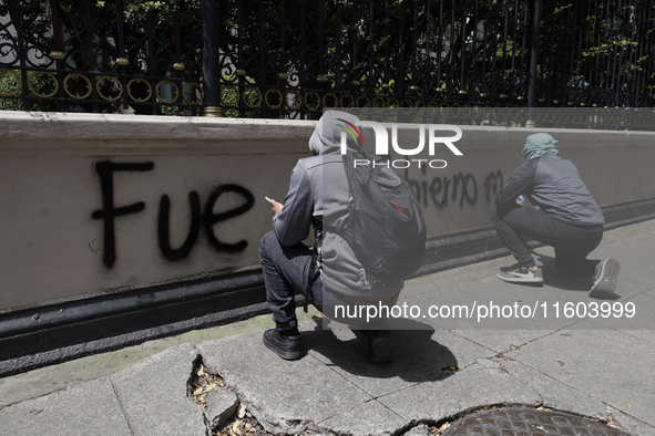 Comrades of the 43 missing students from Ayotzinapa take direct action outside the Ministry of the Interior in Mexico City, Mexico, on Septe...