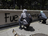 Comrades of the 43 missing students from Ayotzinapa take direct action outside the Ministry of the Interior in Mexico City, Mexico, on Septe...