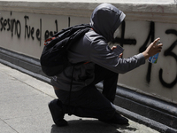 Comrades of the 43 missing students from Ayotzinapa take direct action outside the Ministry of the Interior in Mexico City, Mexico, on Septe...