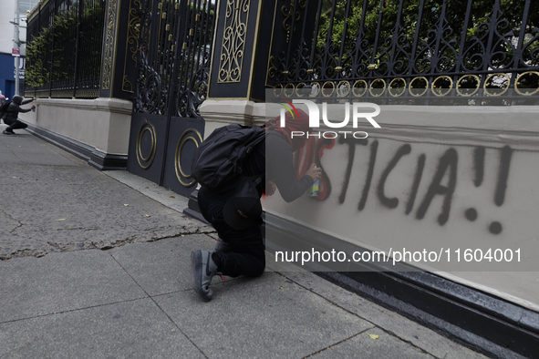 Comrades of the 43 missing students from Ayotzinapa take direct action outside the Ministry of the Interior in Mexico City, Mexico, on Septe...