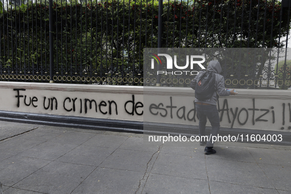 Comrades of the 43 missing students from Ayotzinapa take direct action outside the Ministry of the Interior in Mexico City, Mexico, on Septe...