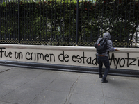 Comrades of the 43 missing students from Ayotzinapa take direct action outside the Ministry of the Interior in Mexico City, Mexico, on Septe...