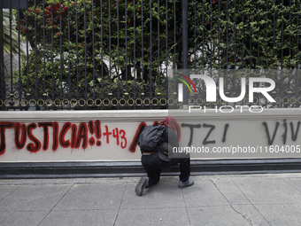 Comrades of the 43 missing students from Ayotzinapa take direct action outside the Ministry of the Interior in Mexico City, Mexico, on Septe...