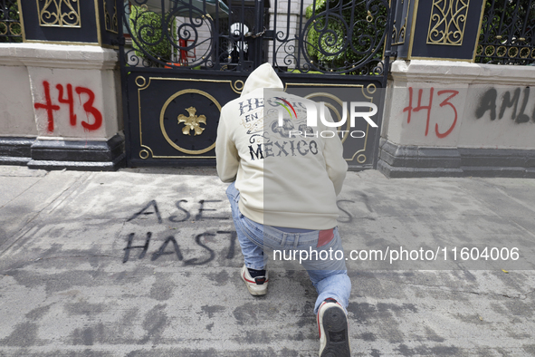 Comrades of the 43 missing students from Ayotzinapa take direct action outside the Ministry of the Interior in Mexico City, Mexico, on Septe...