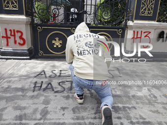 Comrades of the 43 missing students from Ayotzinapa take direct action outside the Ministry of the Interior in Mexico City, Mexico, on Septe...