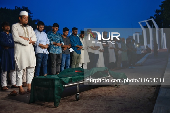 People perform the funeral prayer for Junaid Islam Ratul at the Central Shaheed Minar in Dhaka, Bangladesh, on September 23, 2024. Ratul, wh...