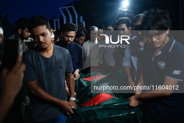 People perform the funeral prayer for Junaid Islam Ratul at the Central Shaheed Minar in Dhaka, Bangladesh, on September 23, 2024. Ratul, wh...