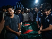 People perform the funeral prayer for Junaid Islam Ratul at the Central Shaheed Minar in Dhaka, Bangladesh, on September 23, 2024. Ratul, wh...