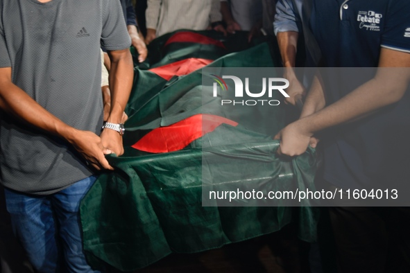 People perform the funeral prayer for Junaid Islam Ratul at the Central Shaheed Minar in Dhaka, Bangladesh, on September 23, 2024. Ratul, wh...