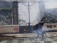 Colleagues of the 43 missing students from Ayotzinapa fire rockets on Monday, September 23, 2024, outside the Ministry of the Interior in Me...